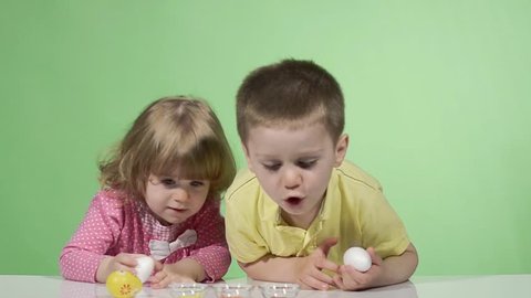 Kids painting easter eggs 