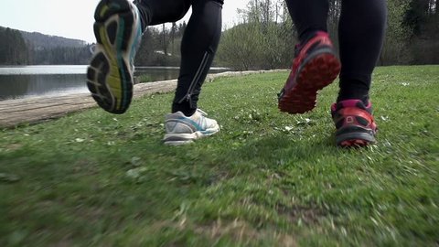 Close Up On Shoes Running On Grass in Slow Motion