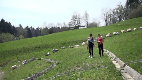 Slow Motion Two Athletic Girls Walking After Long Run In Nature