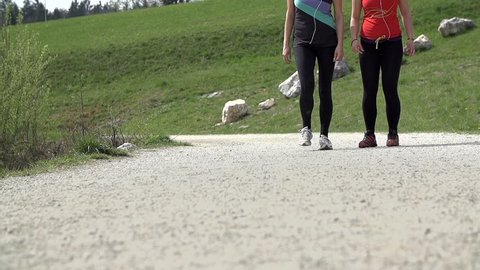 Slow Motion Female Legs Running On Rocky Path