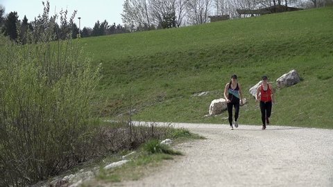 Slow Motion Two Athletic Girls Running In Nature
