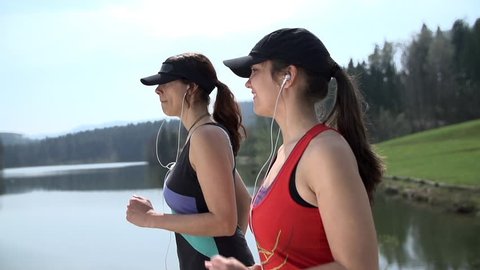 Fit Female Friends Preparing For Running Competition