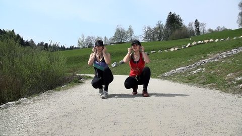 Slow Motion Two Fit Friends Preparing To Run In Nature