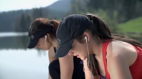Two Girls Breathing And Preparing To Run