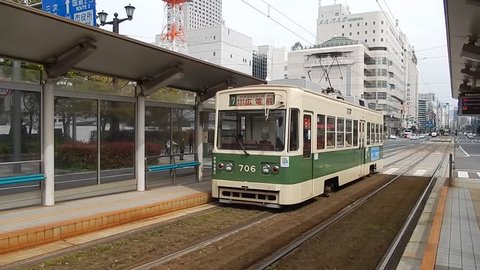 HIROSHIMA, JAPAN - APRIL 1: Train arriving at station at April 1, 2014 in Hiroshima, Japan. Hiroshima is on e of the few cities in Japan where there are trams for public transport.