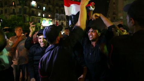 CAIRO, EGYPT, CIRCA 2013 - Protestors chant at a nighttime rally in Cairo, Egypt.