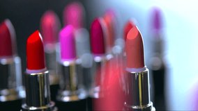 Fashion Colorful Lipstick. Professional Makeup and Beauty. Beautiful Make-up concept. Lipgloss. Lipsticks closeup. Slow motion full HD video footage 1080p
