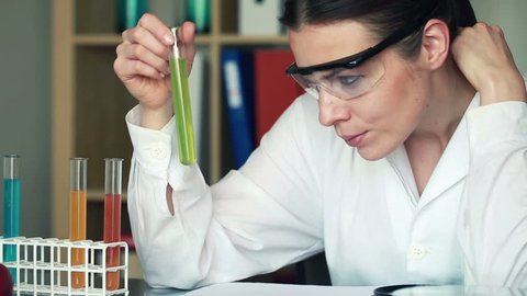 Portrait of young beautiful female scientist in laboratory
