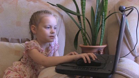 girl playing in a laptop