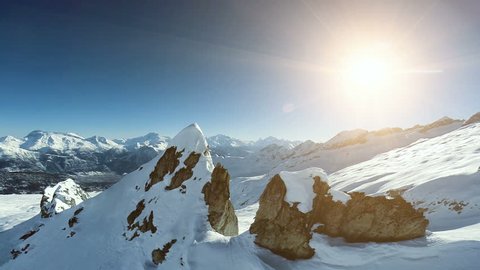 overlooking snow mountains. aerial view. fly over. epic alps panorama. winter landscape 