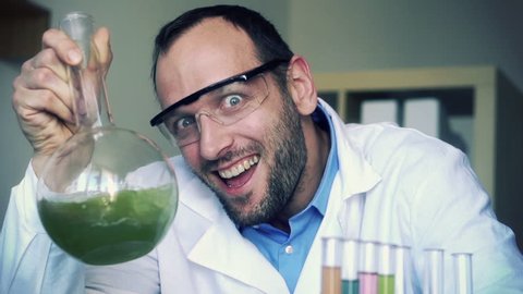Crazy, mad scientist laughing in laboratory, super slow motion, shot at 240fps
