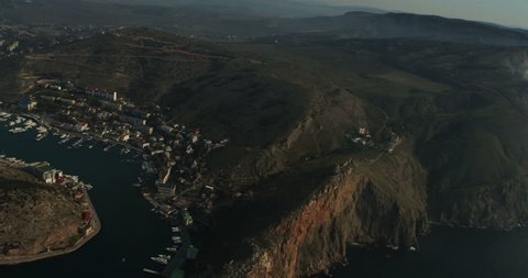 Aerial View: Flight over the Coast. Balaklava bay, Crimea, autumn 2013. Balaklava is a small town on the Black Sea in the south-western tip of the Crimean peninsula. Now is a popular Crimean resort.
