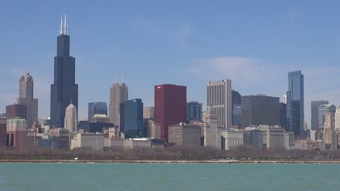 CHICAGO, USA - APRIL 17, 2013, Timelapse of Sears Tower skyscraper and traffic street and lake Michigan by day