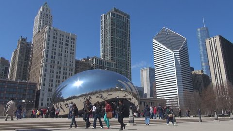 CHICAGO, USA - APRIL 17, 2013, Cloud Gate, mirror sculpture and people tourist travel in holiday in sunny day