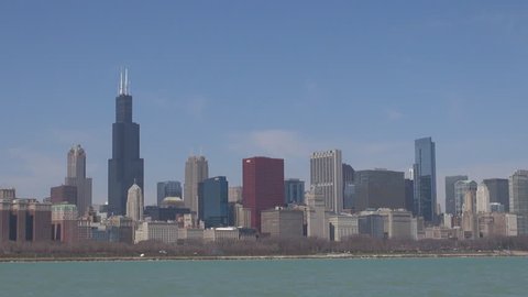 CHICAGO, USA - APRIL 17, 2013, Pan right, panoramic view of Chicago financial district, blue sky and Lake Michigan by day