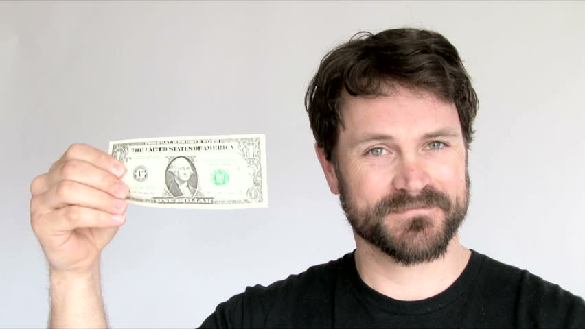 Model released man in studio with a crisp one dollar bill, 3 clip series. | Shutterstock HD Video #6076613