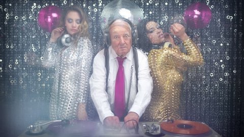 grandpa DJ is back, with his 2 beautiful sexy disco dancers. useful clip for music, lifestyle and fashion