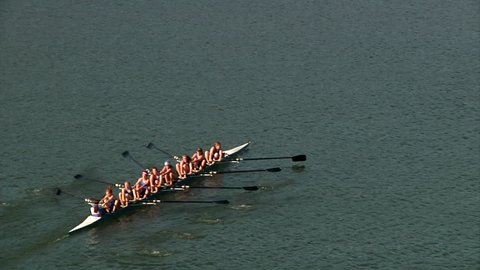 Crew team members prepare and race in the Row Regatta on the Allegheny River on Pittsburgh's north shore.