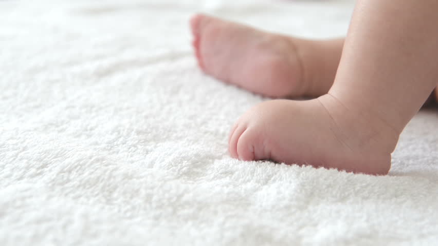 baby feet on white background high Stock Footage Video (100% Royalty