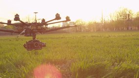 SLOW MOTION: Drone flying low above the field