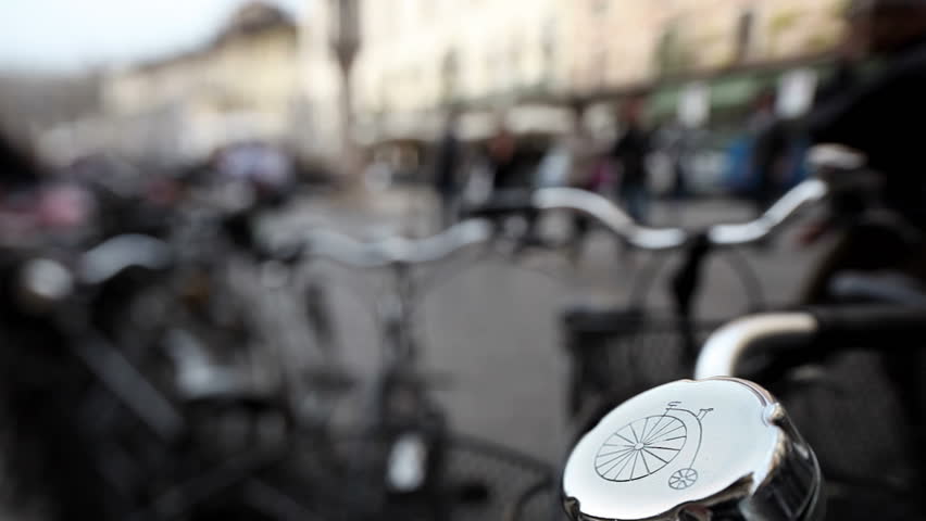 People walking near a bike parking in Verona.