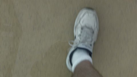 Man walking shorts tennis shoes POV point of view.  Man on vacation on a luxury cruise ship. Walking for more fun and excitement on deck. Exercise and fitness.
