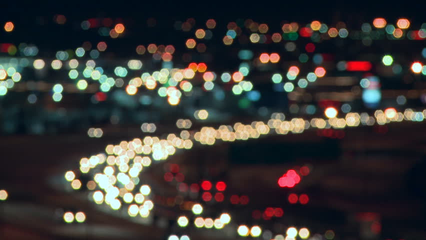 Soft focus on lights of city night traffic