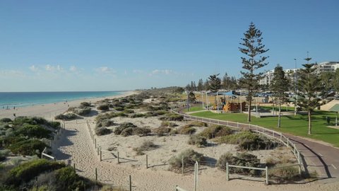 Pan over Scarborough beach and sand dunes, Perth, Australia