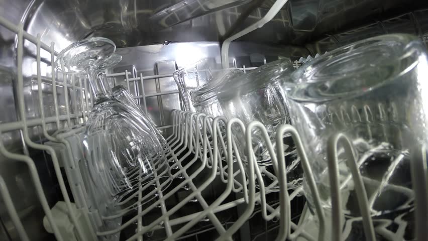Dishwasher washes dishes glasses utensils clean and bright - an inside look. Royalty-Free Stock Footage #6105650