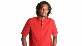 Casual young African American man with dreadlocks posing in red polo shirt