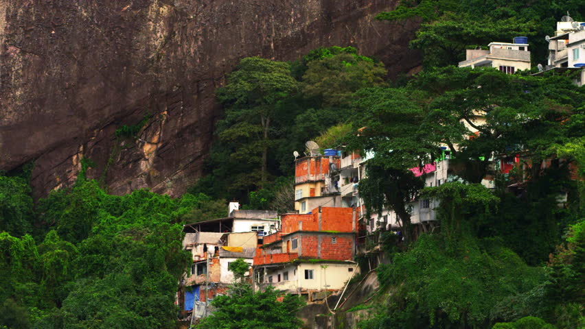 Panning shot of a favela along the mountainside in Rio de Janeiro, Brazil