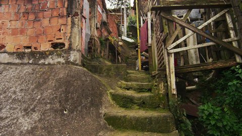 Tracking shot of shanties along the stairs in a favela in Rio de Janeiro, Brazil