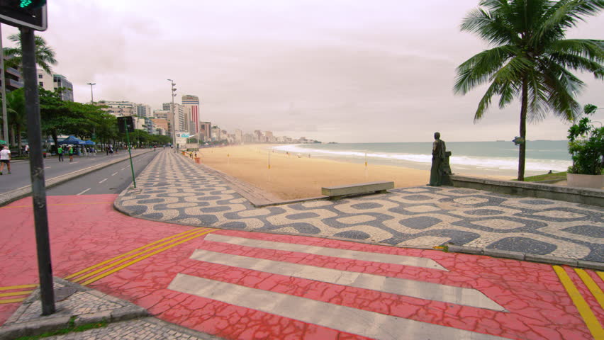 Slow tracking shot of a bronze statue near Ipanema Beach in rio de Janeiro,