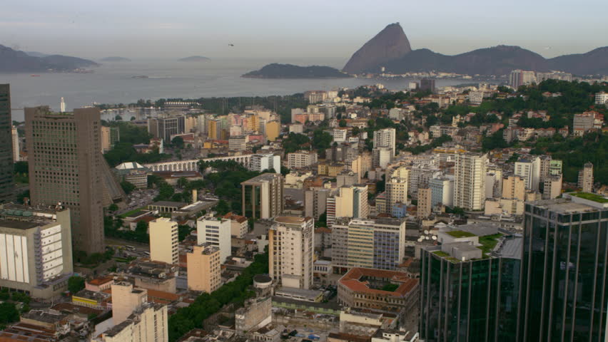 High-definition aerial shot of Rio de Janeiro's buildings and shoreline.