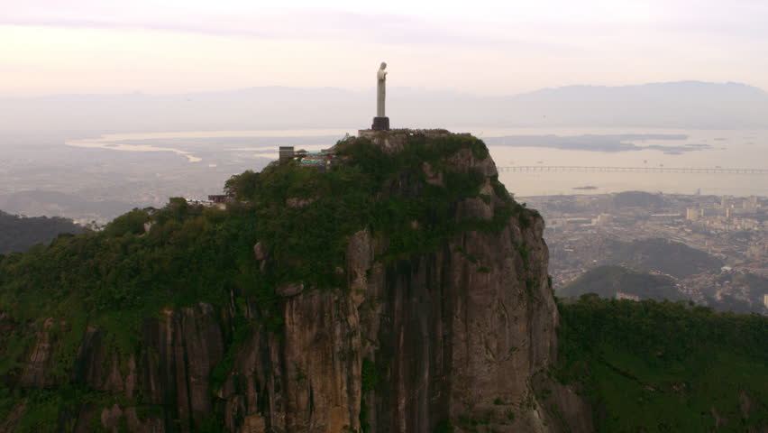 Christ the Redeemer against a setting sky - Rio de Janeiro, Brazil.