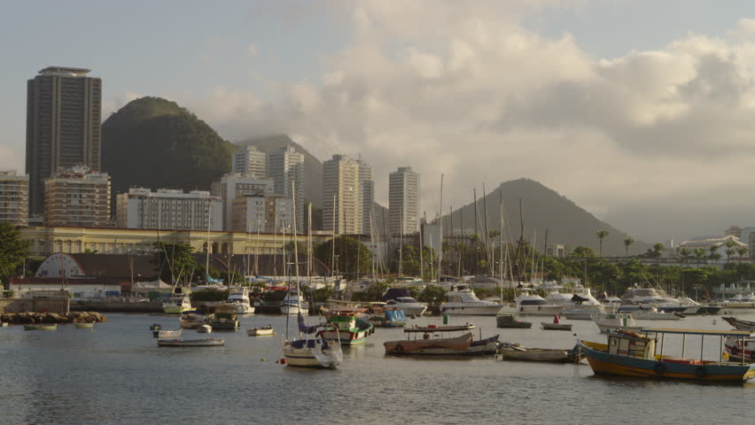 Pan of anchored boats in a hazy Rio marina.