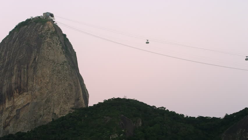 Static shot of two cable cars ascending and descending at Sugarloaf Mountain in