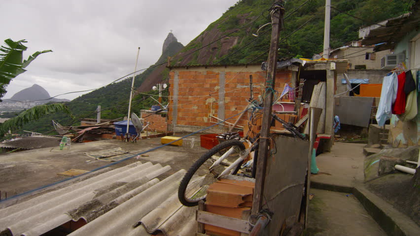 Slow tracking shot of messy area in a favela in Rio de Janeiro, Brazil