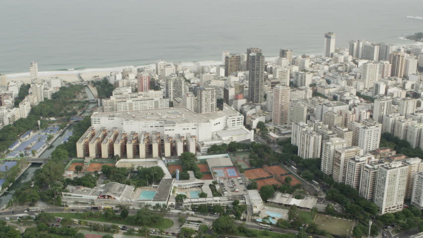 Aerial pan of waterfront skyscrapers
