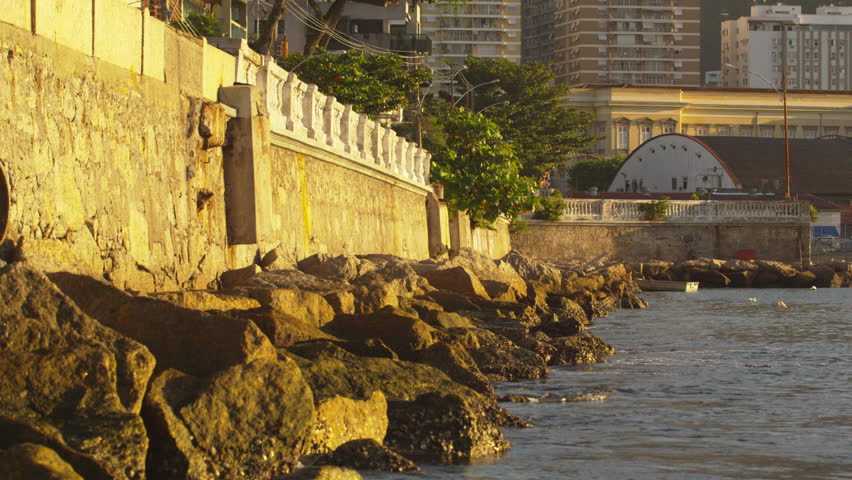 A static shot of a peaceful day along a rocky Rio de Janeiro shore.
