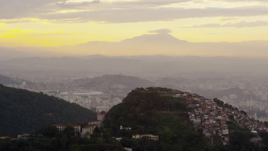 Still shot of the hills beneath a yellow sunset in Rio de Janeiro