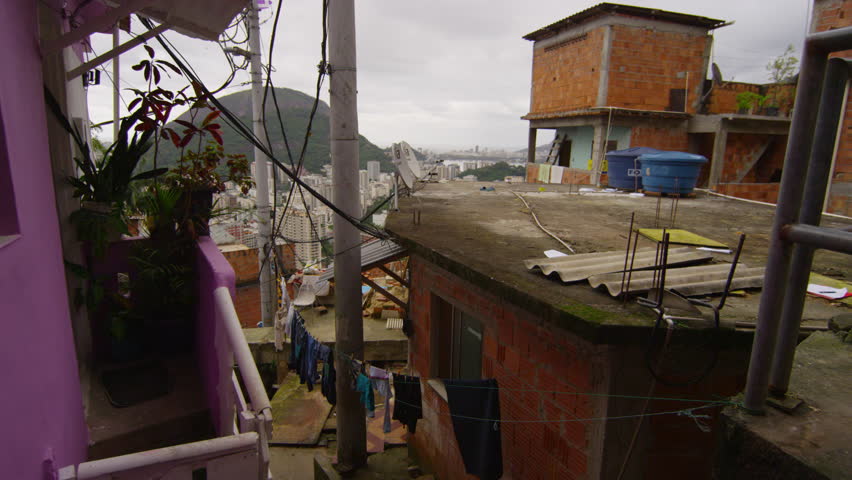 Slow motion tracking shot of apartments in a favela in Rio de Janeiro, Brazil