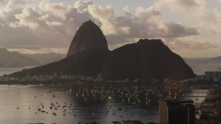 Time-lapse tracking shot of boats moving in Botafogo Bay.