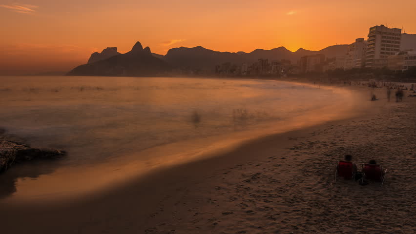 Sunset time-lapse of Rio de Janeiro, overlooking the bay and the beach.