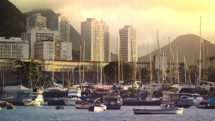 Static shot of Guanabara Bay with various boats and buildings in the distance.