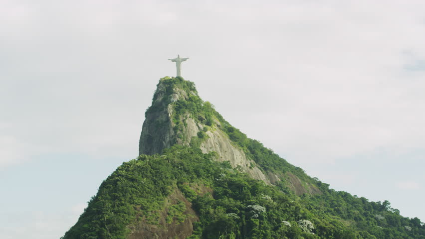 RIO DE JANEIRO, BRAZIL - JUNE: Slow pan of Christ statue and mountain