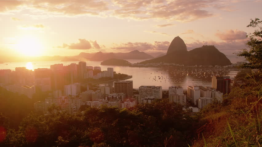 Tracking shot of Rio, Sugarloaf, sunshine, and Botafogo Bay.