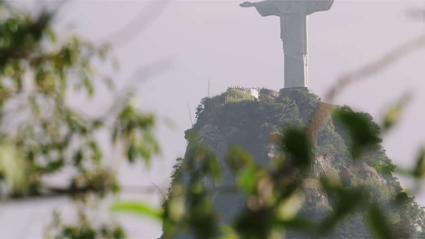 RIO DE JANEIRO, BRAZIL - JUNE: Christ statue atop Corcovado seen through tree