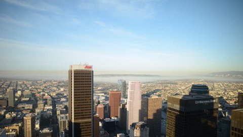 Time Lapse of  Morning Shadow Moving across Downtown Los Angeles Skyline -Tilt Down-