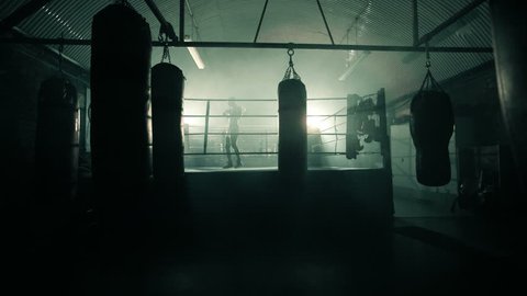 Male Boxer enters the ring and prepares for the fight